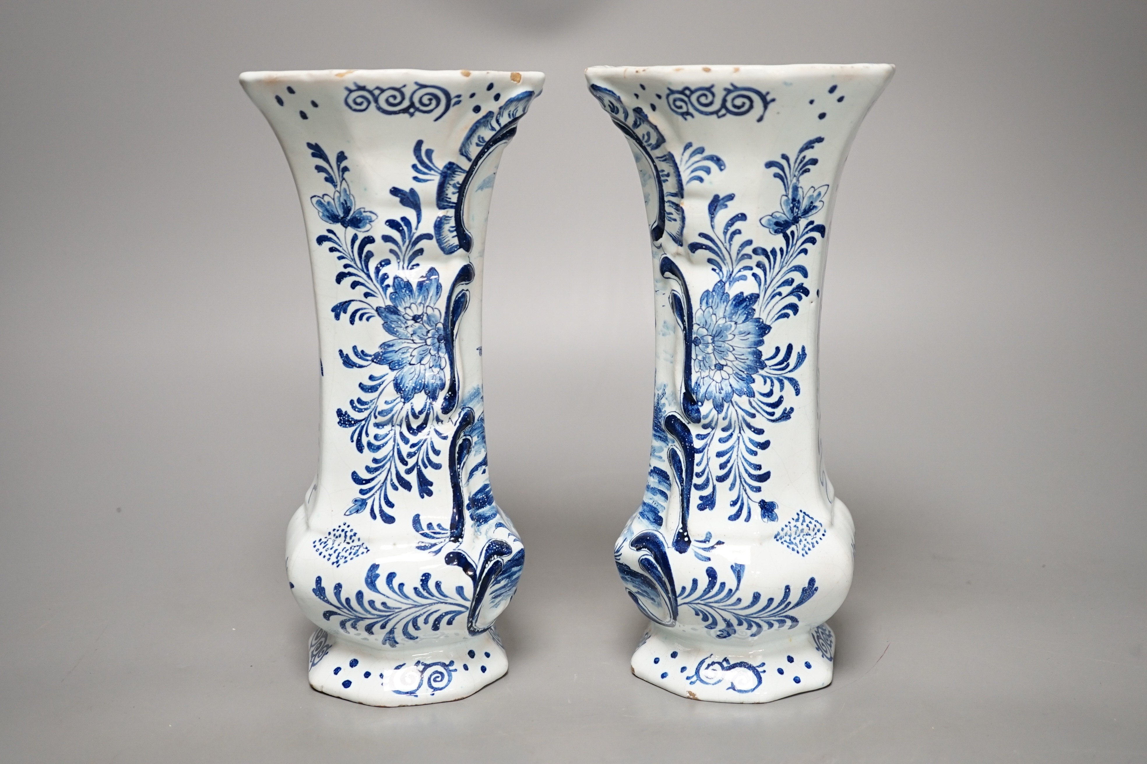 A pair of 19th century Delft blue and white vases 21.5cm